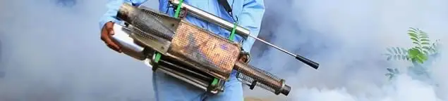 Fumigation technician using a fogger for deep pest treatment in Milwaukee, WI